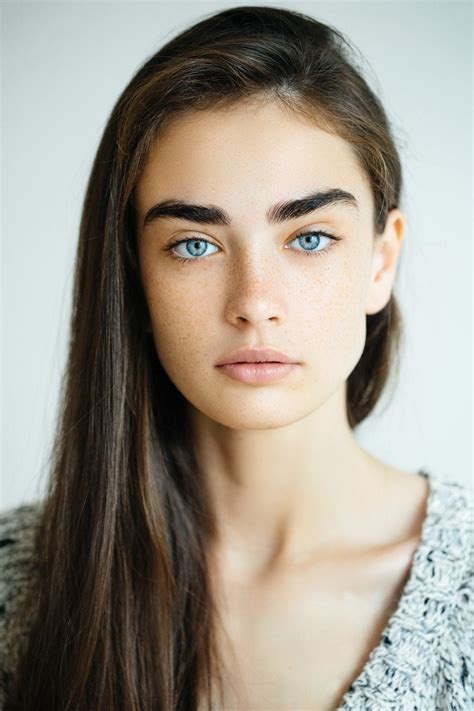 dark hair blue eyes woman